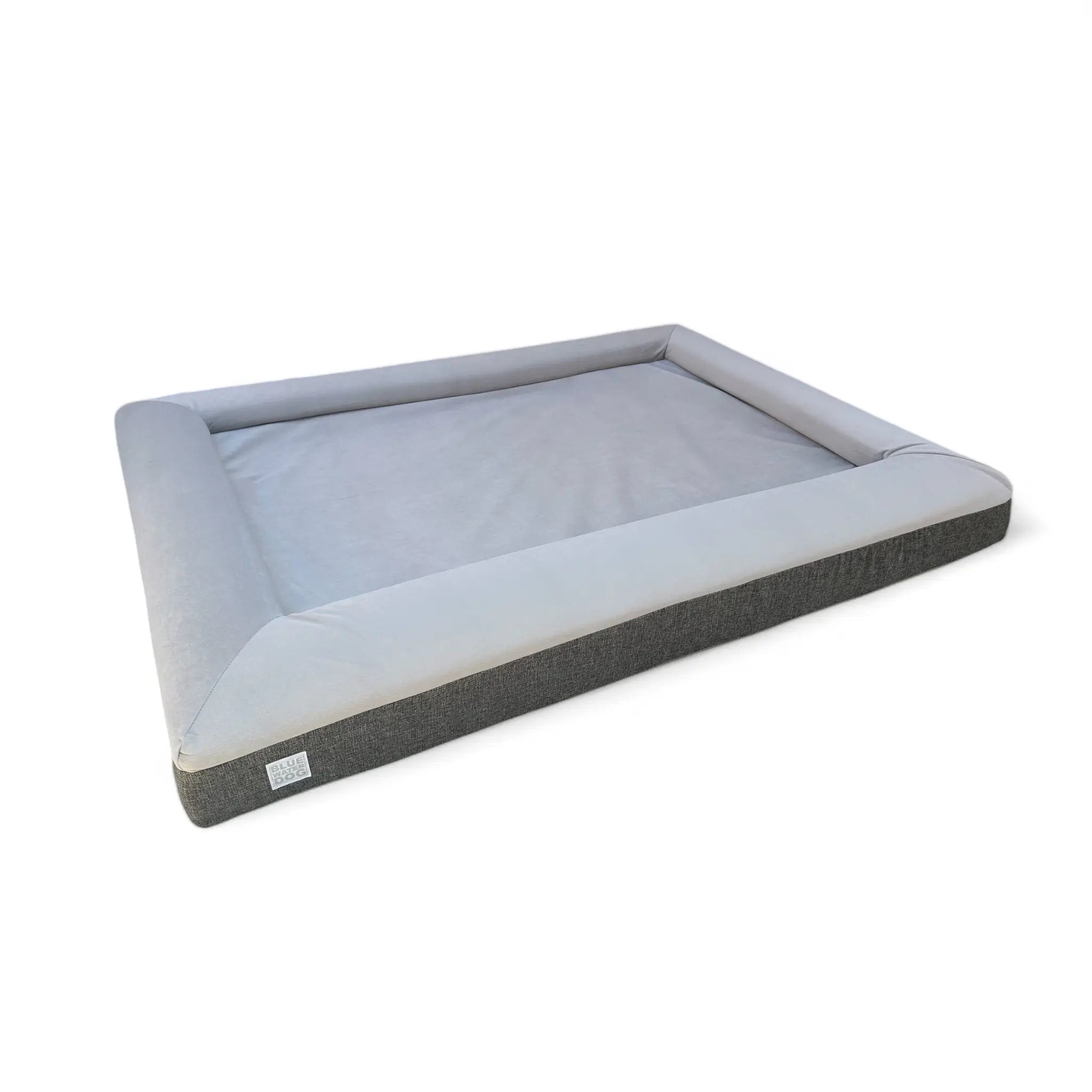 Side of gray orthopedic dog bed.