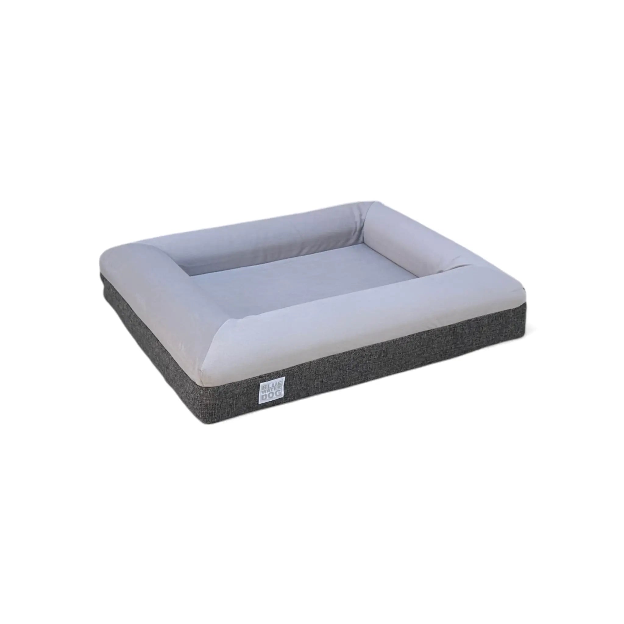 Side view of a small gray orthopedic dog bed.